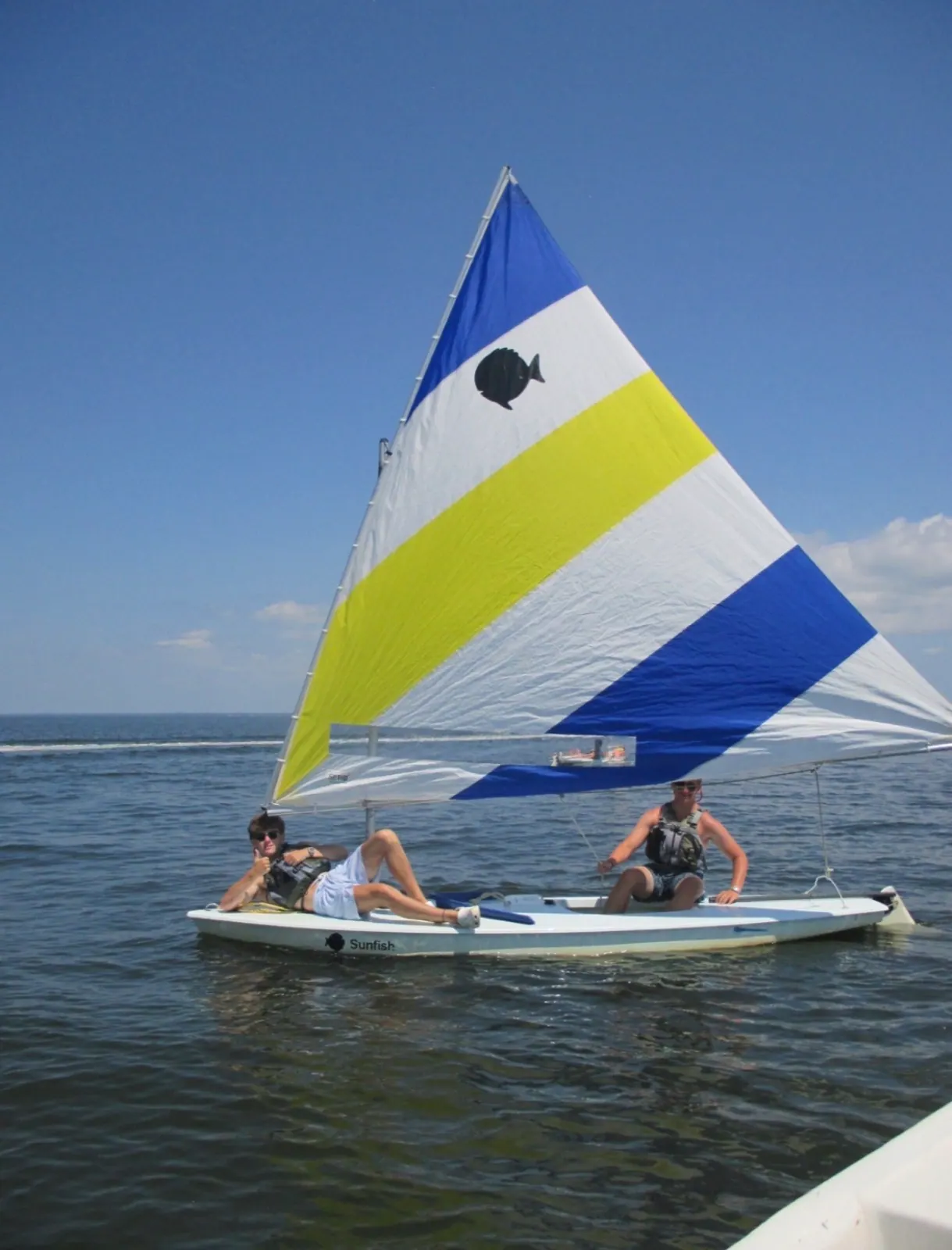 Dylan sailing a Sunfish